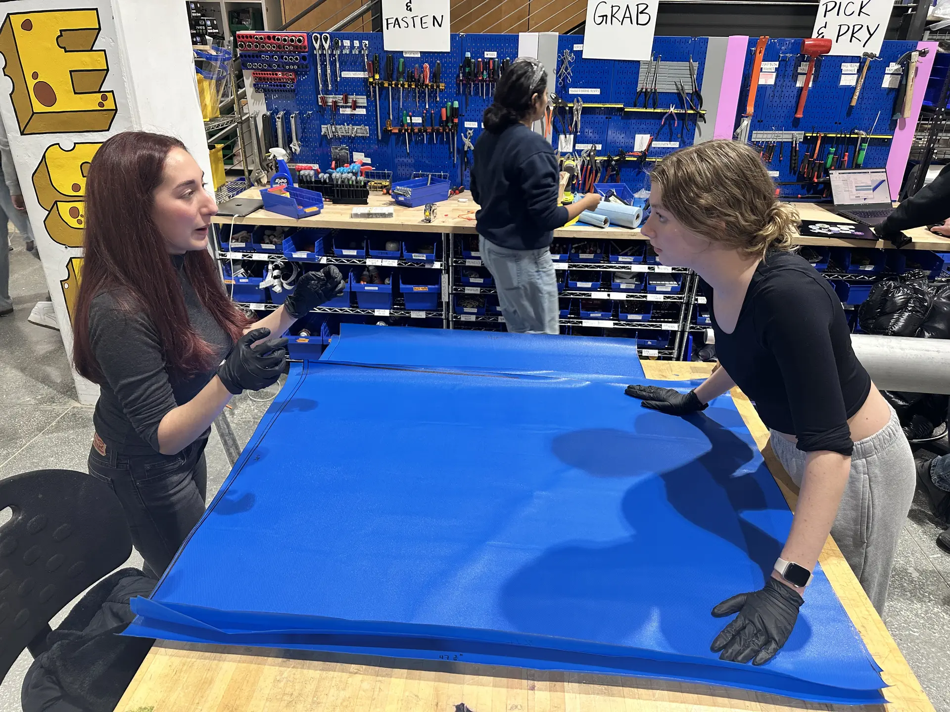 Students manufacturing a structure's component