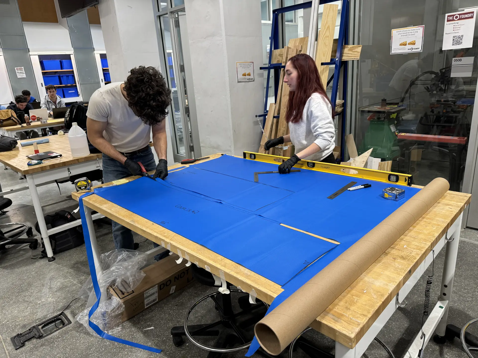 Students manufacturing a structure's component