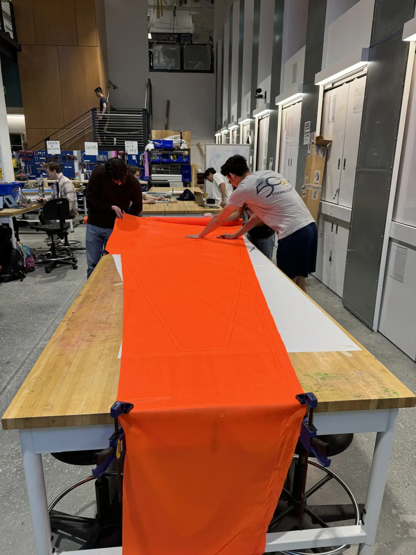 Students manufacturing a parachute
