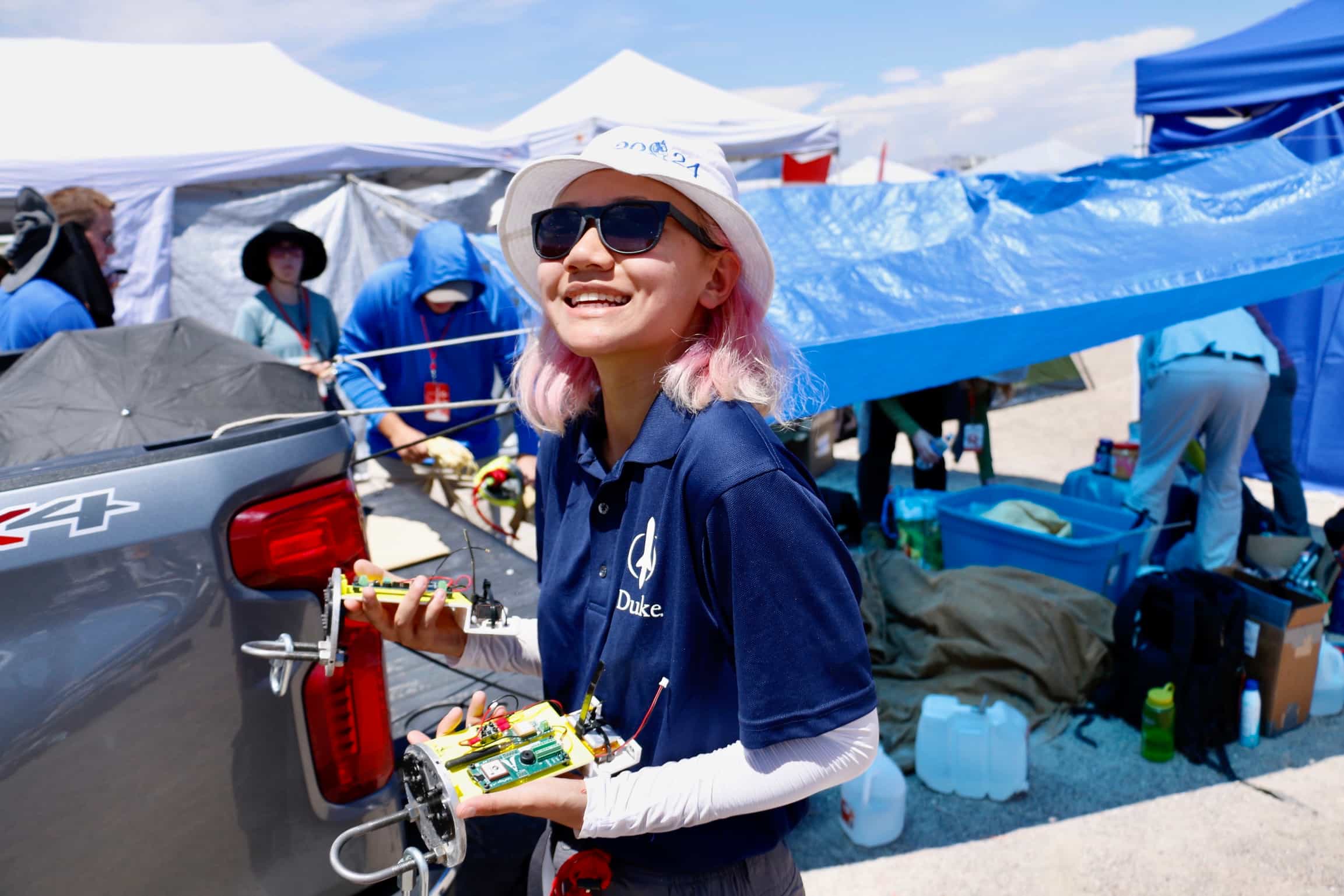 photo of team member with a portion of the avionics bay